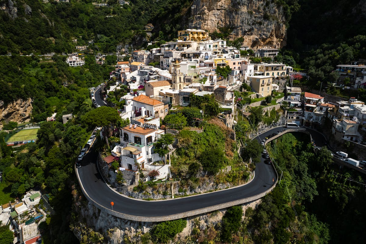 Winding road along the Amalfi Coast with blue sea and cliffs
