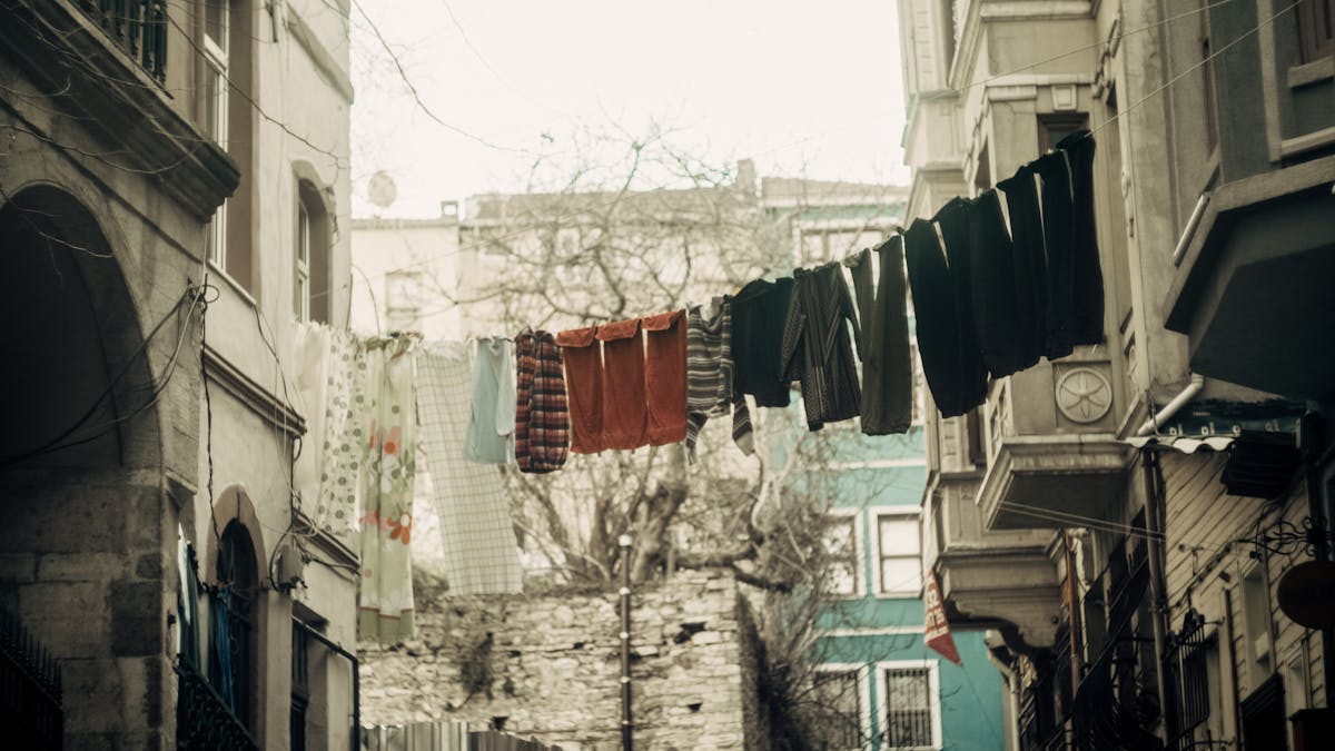 Narrow street in Naples centro storico with laundry hanging between buildings