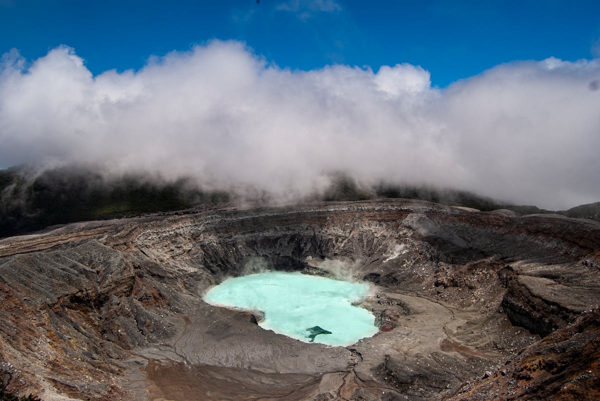 Looking into the crater of Mount Vesuvius with steam rising